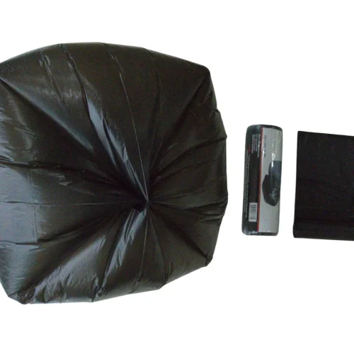 Large black photography umbrella with its folded cover and packaging on a white background.