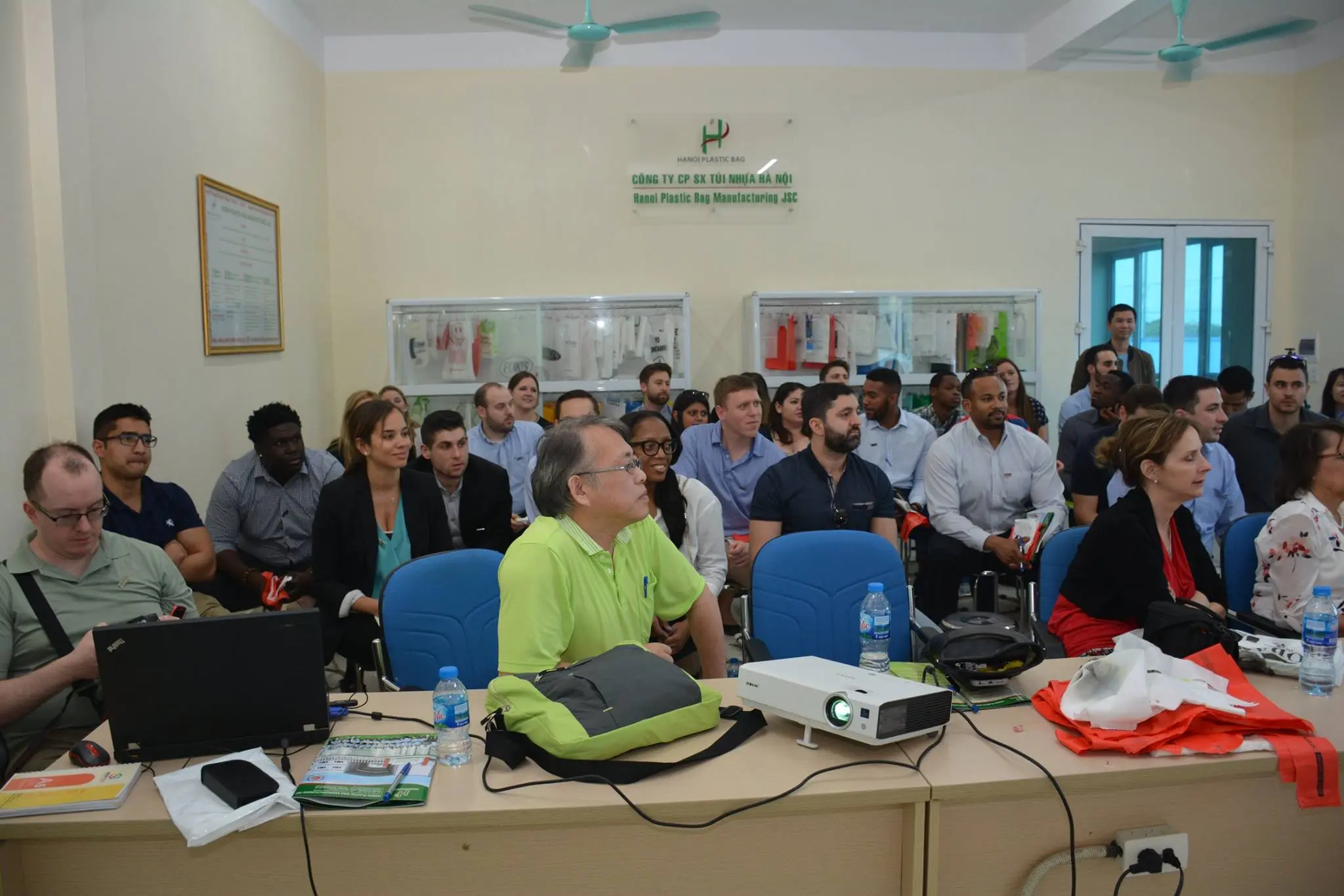 University of Connecticut delegation attending a factory presentation at Hanoi Plastic Bag Manufacturing JSC